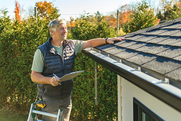 Professional Roof Replacement technician working in Mc Dade, TX